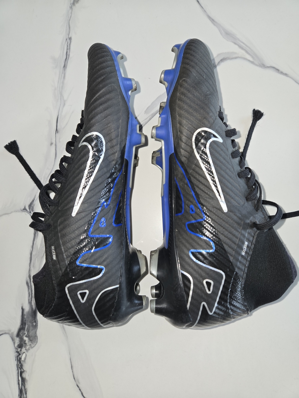 Nike Men's Black and Blue Cleats with White Swoosh